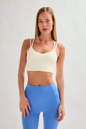 Top beige de tejido compresivo y espalda con tirantes